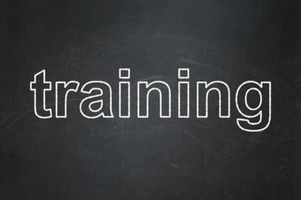 Education concept: Training on chalkboard background — Stock Photo, Image