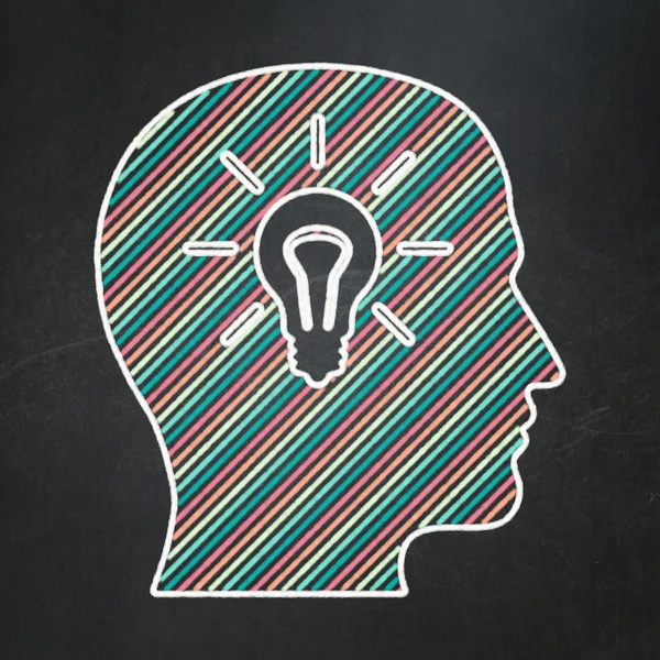 Marketing concept: Head With Light Bulb on chalkboard background — Stock Photo, Image