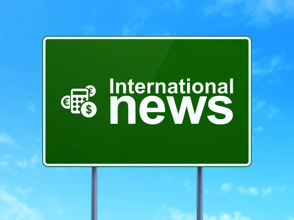 News concept: International News and Calculator on road sign background — Stock Photo, Image