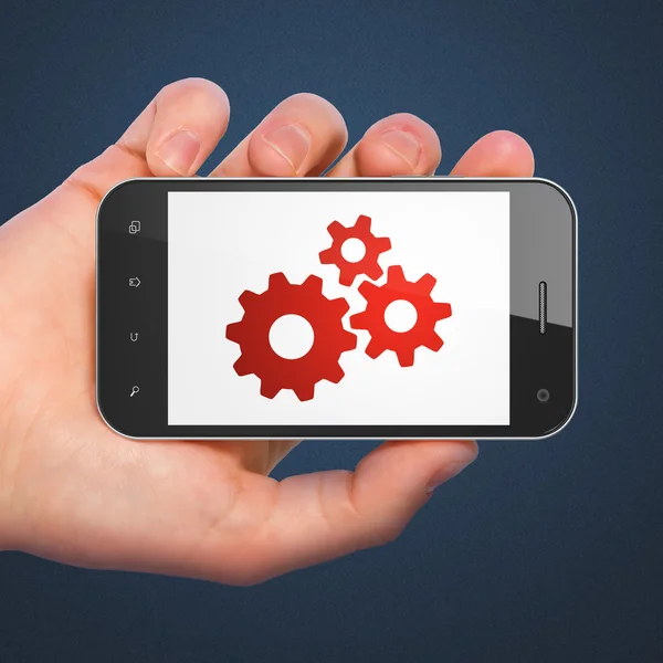 Web ontwikkelingsconcept: Gears op smartphone — Stockfoto