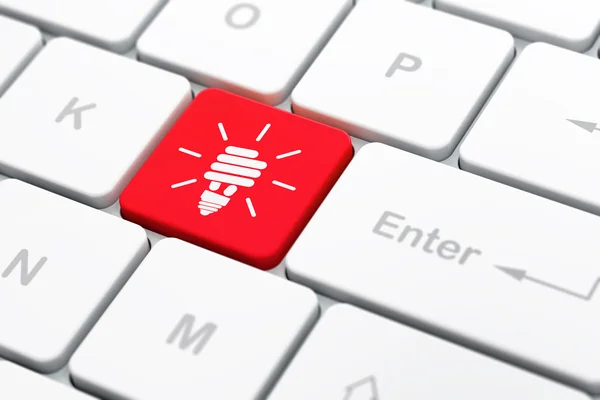 Geschäftskonzept: Energiesparlampe auf Computer-Tastatur Hintergrund — Stockfoto
