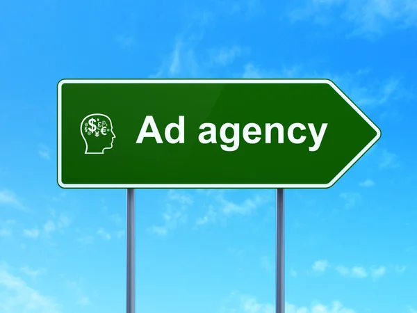 Advertising concept: Ad Agency and Head With Finance Symbol on road sign background — Stock Photo, Image