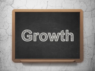 Ekonomi kavramı: Kara tahta arka plan üzerinde büyüme