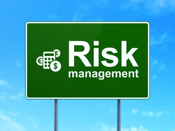 Finance concept: Risk Management and Calculator on road sign background — Stock Photo, Image