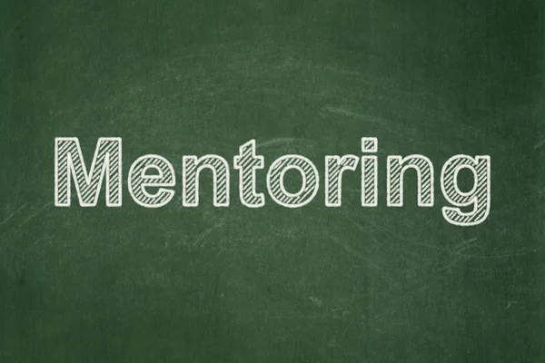 Conceito de educação: Mentoring em fundo quadro-negro — Fotografia de Stock