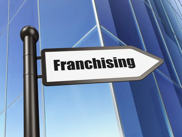 Concetto di finanza: firma Franchising su Building background — Foto Stock