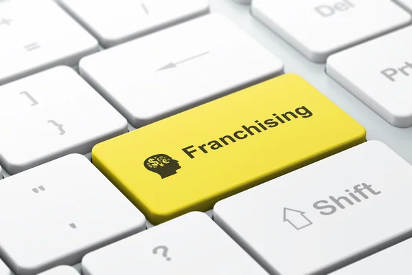 Finans affärsidé: huvudet med finans symbol och franchising på dator tangentbord bakgrund — Stockfoto