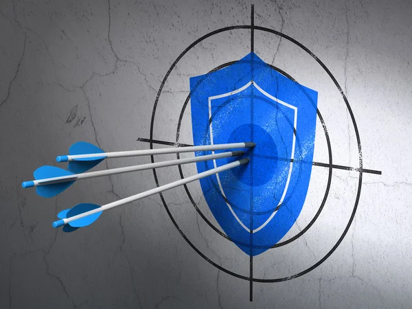 Concept de protection : flèches dans la cible Shield sur fond mural — Photo