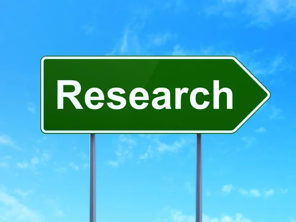 Marketing concept: Research on road sign background — Stock Photo, Image