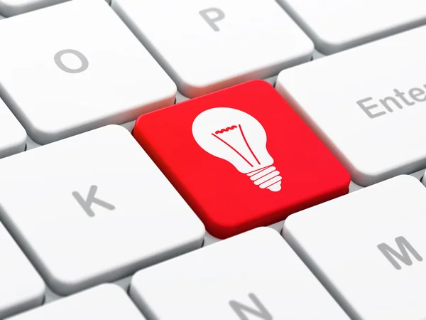 Finance concept: Light Bulb on computer keyboard background — Stock Photo, Image