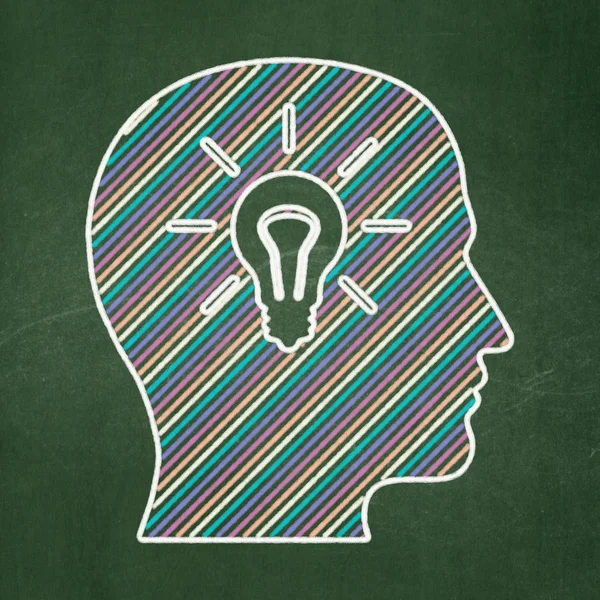 Education concept: Head With Light Bulb on chalkboard background — Stock Photo, Image