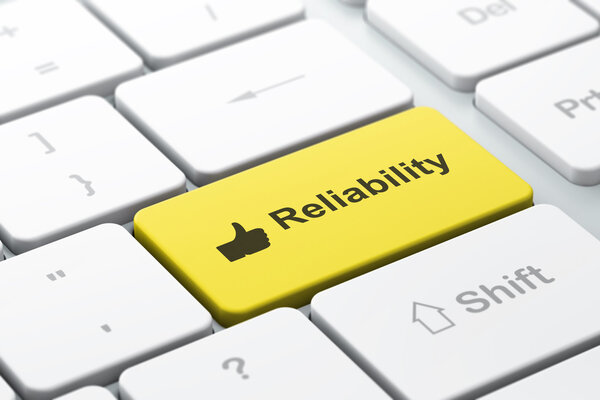 Business finance concept: Thumb Up and Reliability on computer keyboard background
