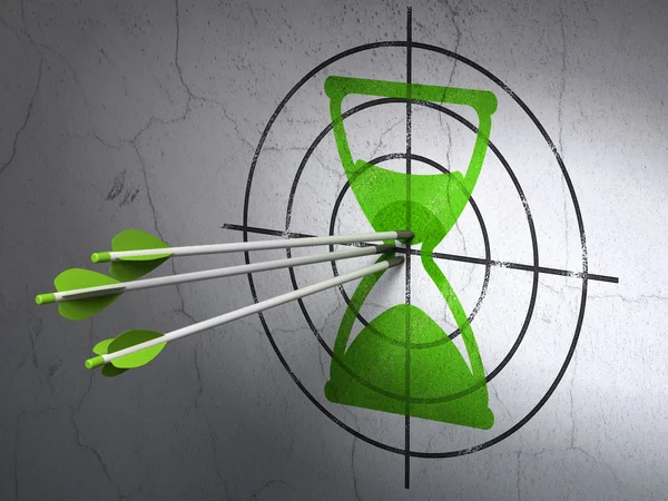 Time concept: arrows in Hourglass target on wall background — Stock Photo, Image