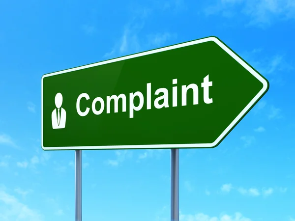 Law concept: Complaint and Business Man on road sign background — Stock Photo, Image