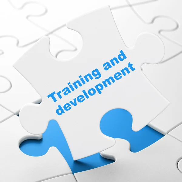 Education concept: Training and Development on puzzle background — Stock Photo, Image