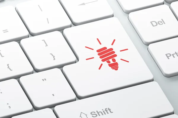 Geschäftskonzept: Energiesparlampe auf Computer-Tastatur Hintergrund — Stockfoto