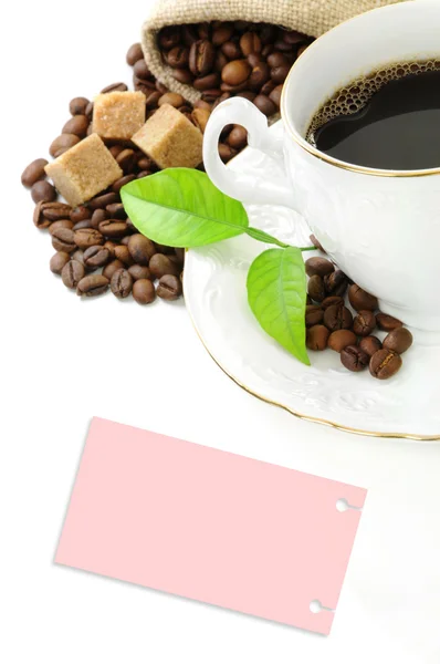 Black coffee, coffee grains, brown sugar and sticker — Stock Photo, Image