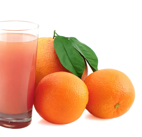 Grapefruit, pomeranč a šťáva. — Stock fotografie