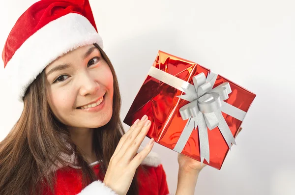 Santa claus klobouk s červenou Vánoční dárková krabička — Stock fotografie