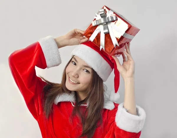 Santa claus hat with red christmas gift box — Stock Photo, Image