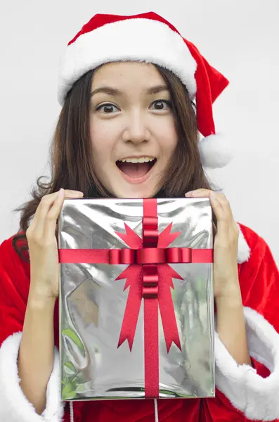 Santa claus hat with grey christmas gift box — Stock Photo, Image