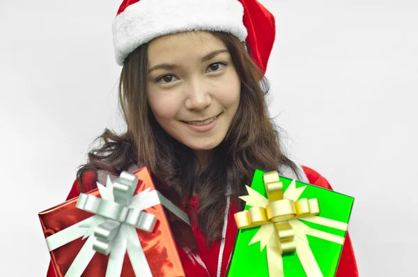 Santa claus hat with christmas gift boxes — Stock Photo, Image