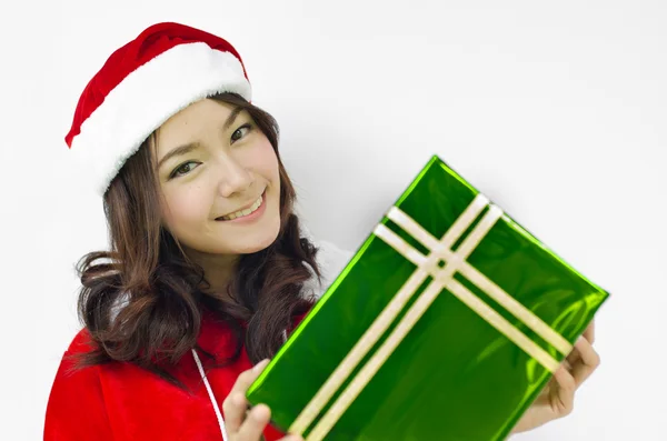 Weihnachtsmann Hut mit grüner Weihnachtsgeschenkschachtel — Stockfoto
