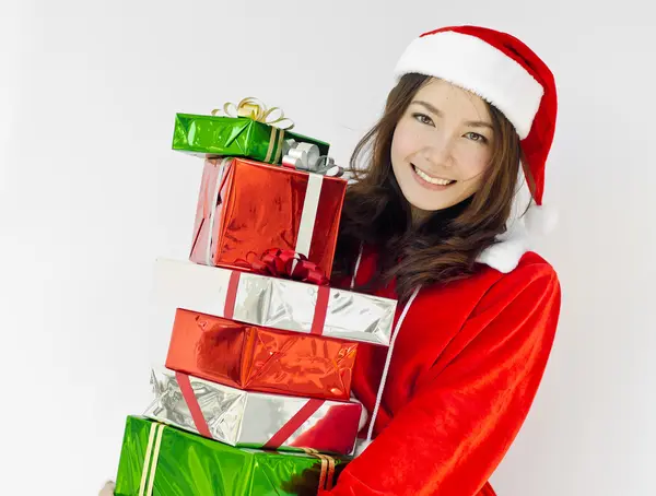 Santa claus hat with christmas gift boxes — Stock Photo, Image