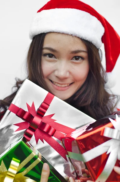 Santa claus hat with christmas gift boxes — Stock Photo, Image