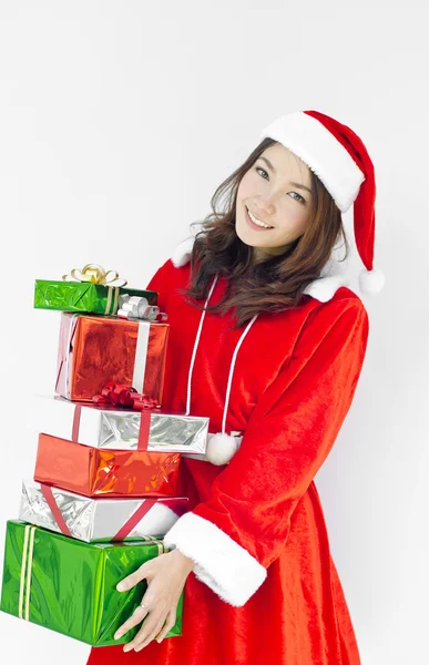 Santa claus hat with christmas gift boxes — Stock Photo, Image