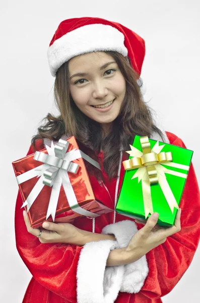 Santa claus hat with christmas gift boxes — Stock Photo, Image