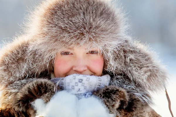 Happy young girl in a fur hat — Stock Photo, Image