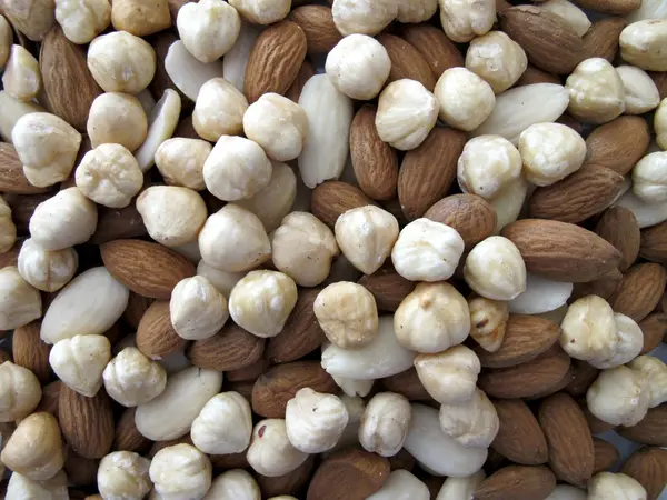 Background of almonds and hazelnuts — Stock Photo, Image