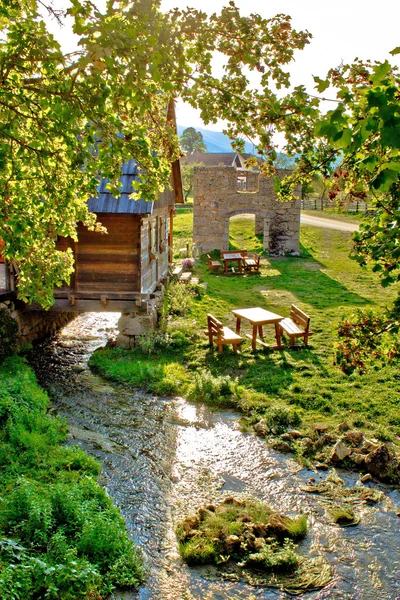 Gacka river spring watermill and historic ruins — Stock Photo, Image