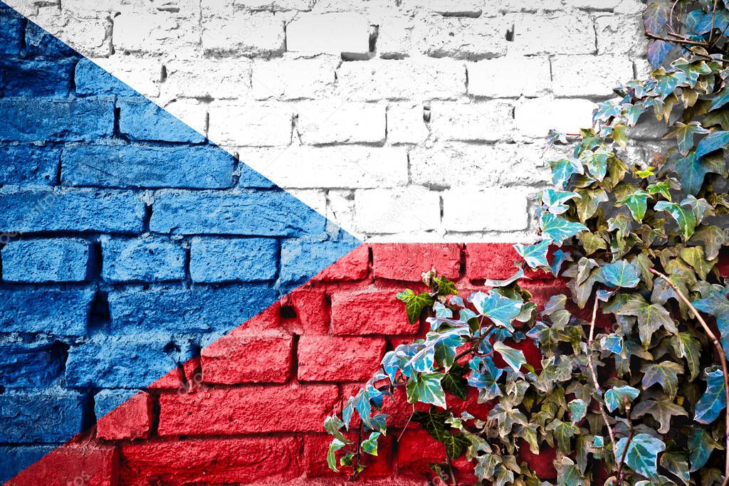 Czechia grunge flag on brick wall with ivy plant, country symbol of Czech Republic