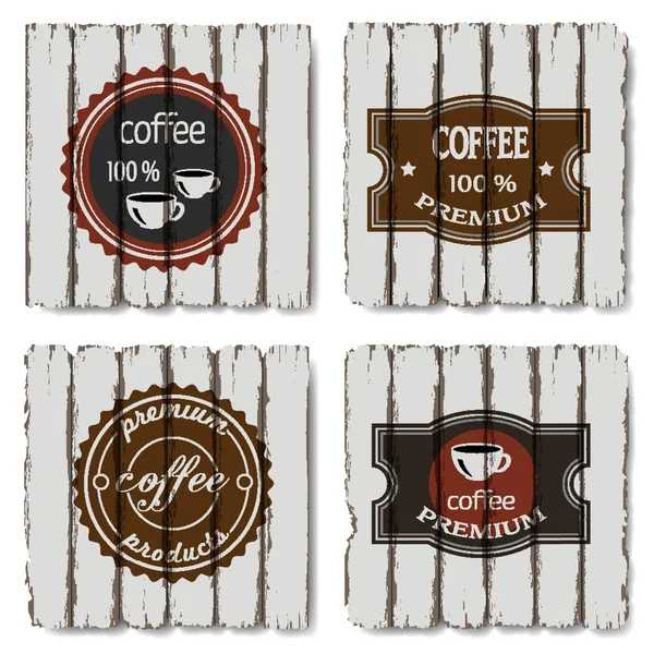 Vier koffie labels op oude hout achtergrond — Stockvector