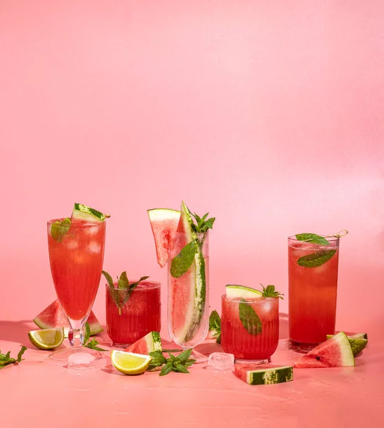 Different Elegant Glasses Watermelon Cocktail Splash Splatter Water Drops Pink — Φωτογραφία Αρχείου