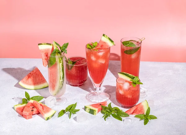 Different Elegant Glasses Watermelon Cocktail Splash Splatter Water Drops Pink — Fotografia de Stock
