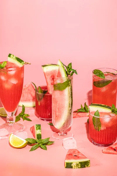 Different Elegant Glasses Watermelon Cocktail Splash Splatter Water Drops Pink — Stock Fotó