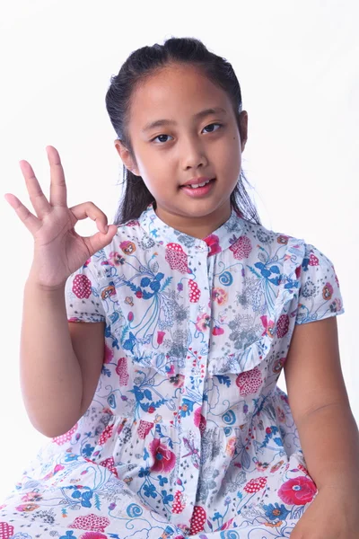 Thai girl shows a sign — Stock Photo, Image