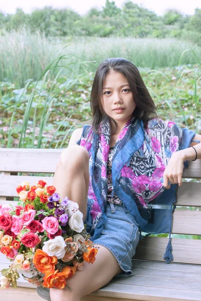 Woman and flower in hand — Stock Photo, Image