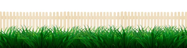 Wooden fence and green grass leaves — Stock Photo, Image