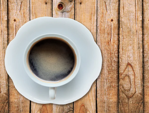 Bovenaanzicht van een koffiekopje op tafel — Stockfoto