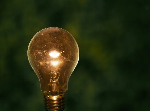 Light bulb with low key background — Stock Photo, Image