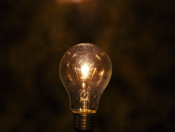 Light bulb with low key background — Stock Photo, Image