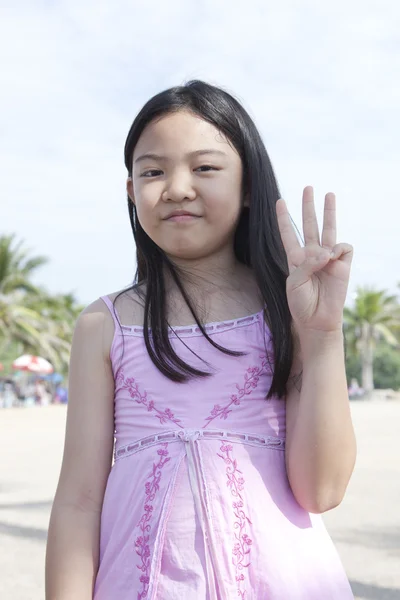 Asian girl show finger acting symbols — Stock Photo, Image