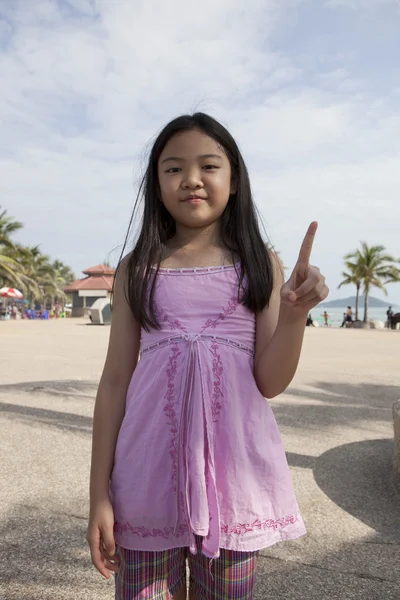 Asian girl show finger acting symbols — Stock Photo, Image