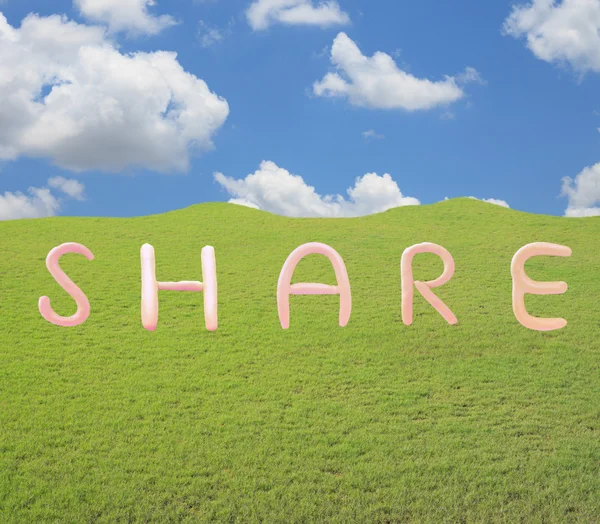 Word share on grass field — Stock Photo, Image