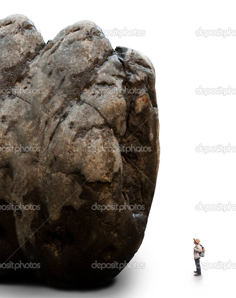 man standing infont of rock mountain
