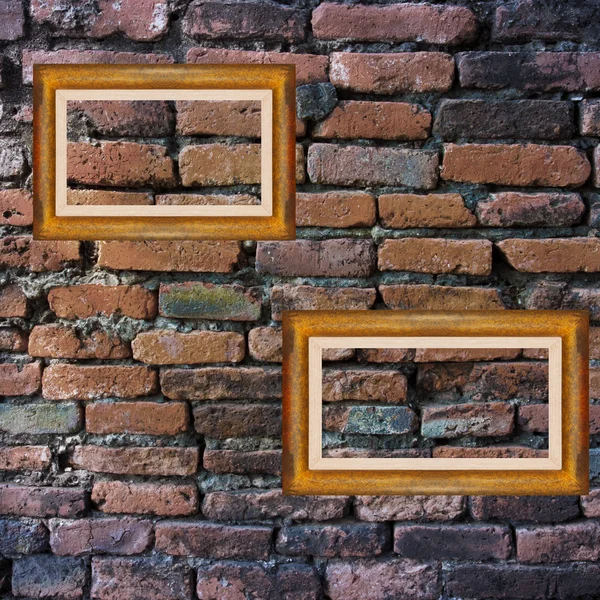 Old brick wall and picture frames — Stock Photo, Image